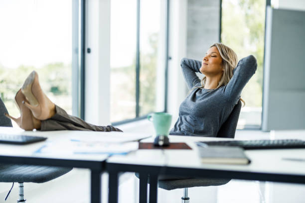 Relaxed businesswoman having a break in the office.