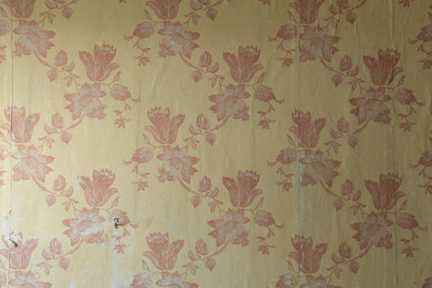 istock Old wallpaper on the wall. Old wallpaper for texture or background. 1691989808