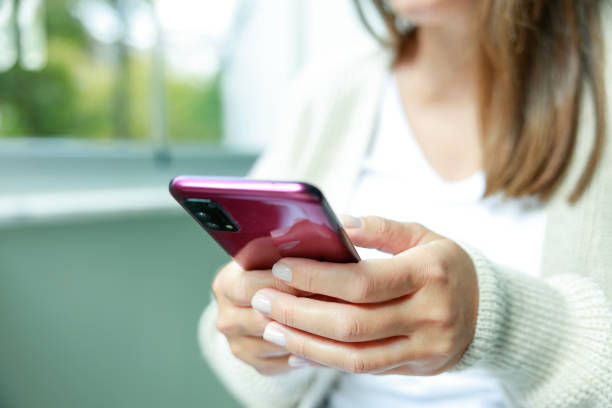 istock Young woman using phone at home 1691991495