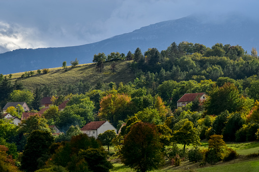 A view of the secluded hilly landscape of a Balkan village in autumn