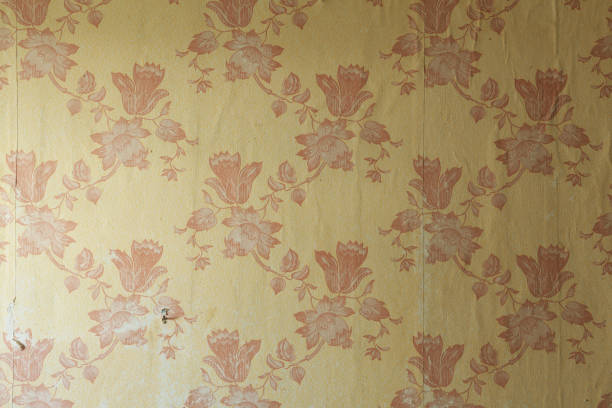 istock Old wallpaper on the wall. Old wallpaper for texture or background. 1691995863