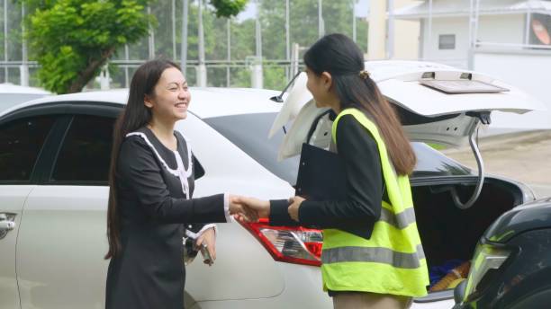 istock Insurance Agent shaking hand with Woman having problems with her car Claims adjusterat car damage. 1692000481
