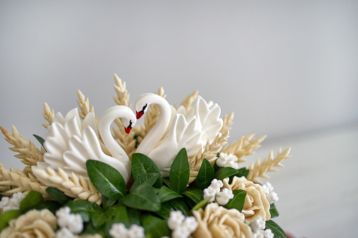 Baking in the form of swans decorates the traditional holiday loaf.