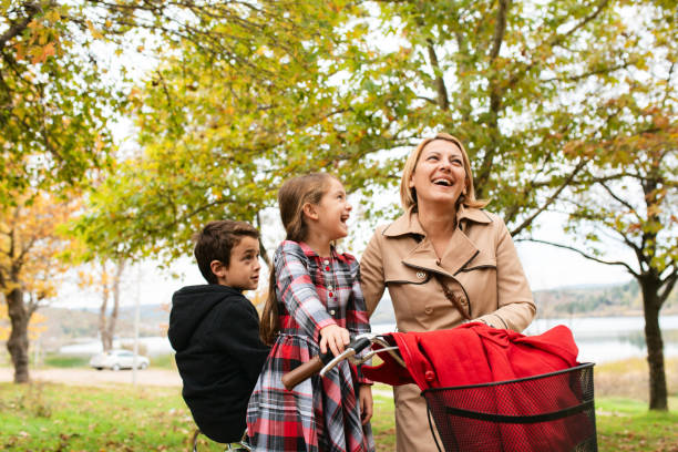 istock Family taking recreation riding bicycles in the forest 1692020332
