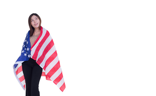 Woman holding USA flag with white background. Space for Text. 4th of July. Celebrate American National Day. Labor Day. Independence Day