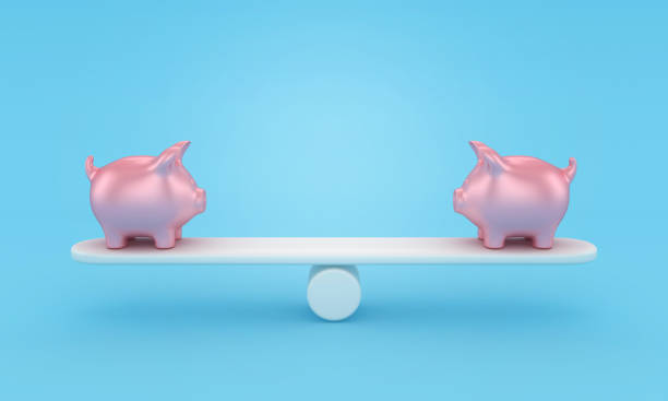 istock Piggy Bank on Seesaw 1692059310