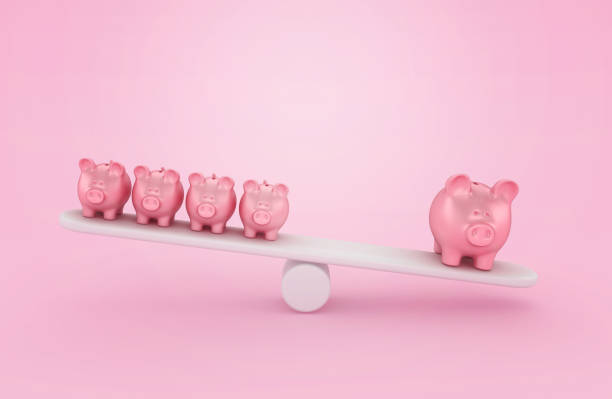 istock Piggy Bank on Seesaw 1692060454