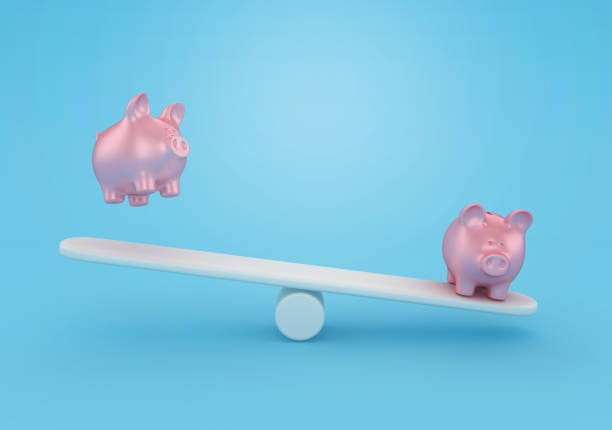 istock Piggy Bank on Seesaw 1692060495