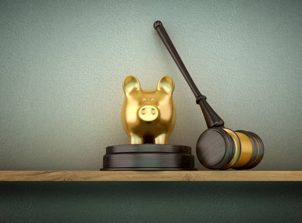 Piggy Bank with Gavel on Shelf stock photo