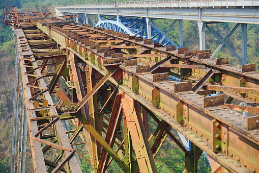 Rusty iron bridge construction. Railway Bridge Construction