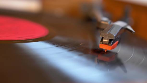 istock Vinyl Record Played on Vintage Turntable Gramophone Close-up 1692066742