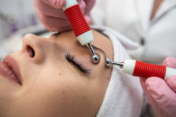 istock Cosmetologist makes hardware procedure for smoothing wrinkles on female face at spa 1692071581