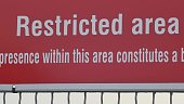 Restricted Area Sign on Military Area Fence