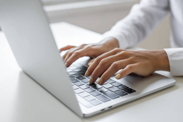 istock Closeup of hands typing 1692093590