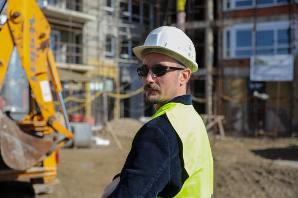 istock Professional technician engineer with protective helmet works on maintenance of construction equipment in industrial factory, inspection man who has production occupation of manufacturing technology 1692094724