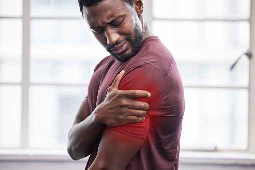 Man, shoulder pain and inflammation from sport exercise workout. African american athlete, frustrated black man and arm muscle injury or medical accident emergency during healthy fitness training