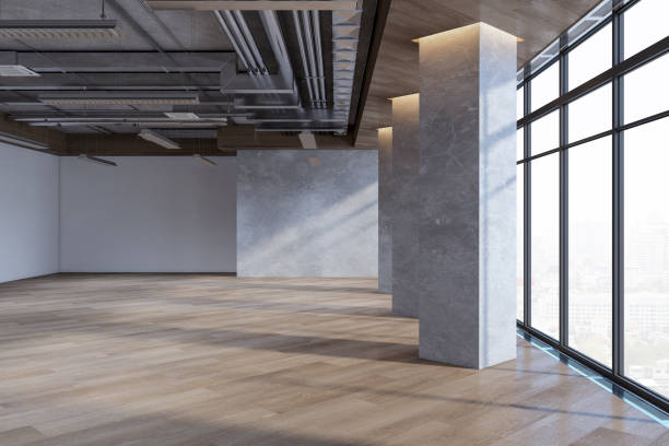 istock Contemporary empty spacious concrete interior with wooden flooring, windows, city view and daylight. 3D Rendering. 1692142277