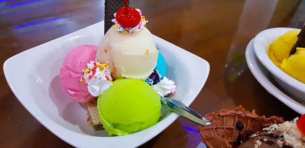Scoops of mixed ice cream on a plate
