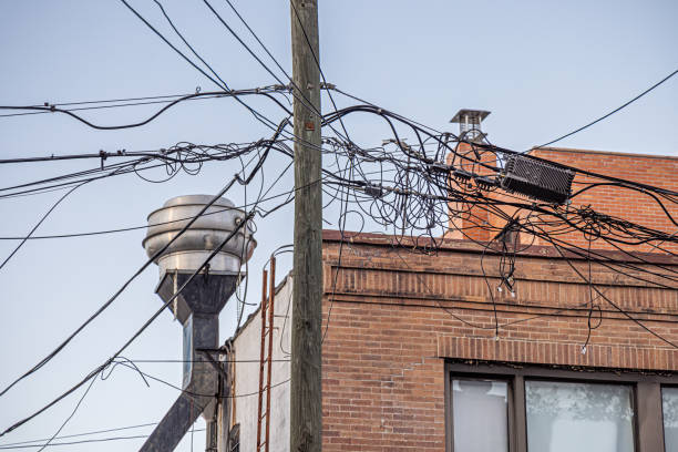 Long Island City, Queens, New York, USA - August 8th 2023:  Picture of a new metal ventilation vent behind a mesh of wires on a street corner in the old par of the city