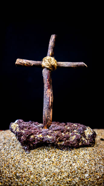istock wooden cross on black background 1692153552