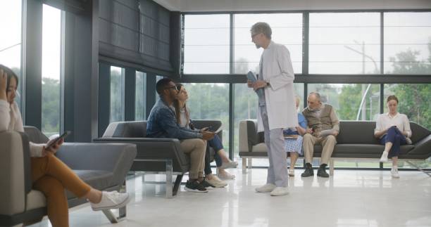 istock Diverse people sit on sofas in clinic waiting area 1692153567