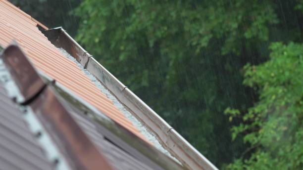 istock Heavy Rain Hitting House Roof and Rain Gutter During Thunderstorm 1692175573