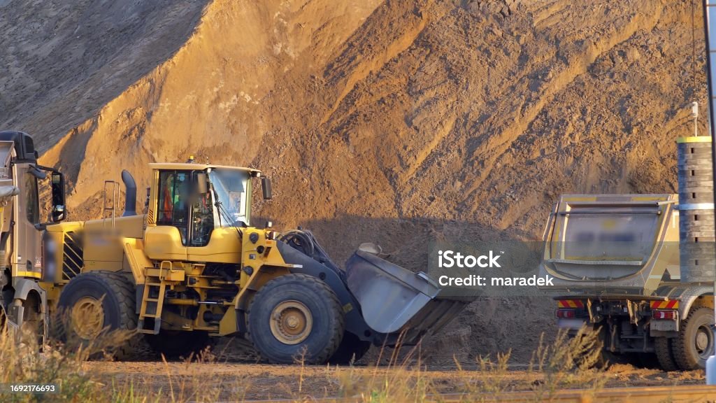 Loader Loading Trucks Front Loader Loading Sand On Dumper Trucks On Construction Site Stock ...