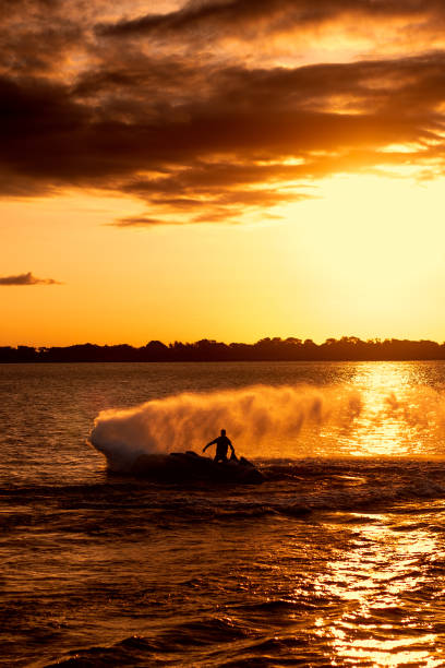 istock A man riding a jetski at sunset 1692177944