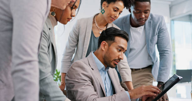istock Teamwork, collaboration and group of business people with tablet for strategy, planning or brainstorming ideas. Meeting, leadership and employees with technology in discussion for advertising project 1692179123