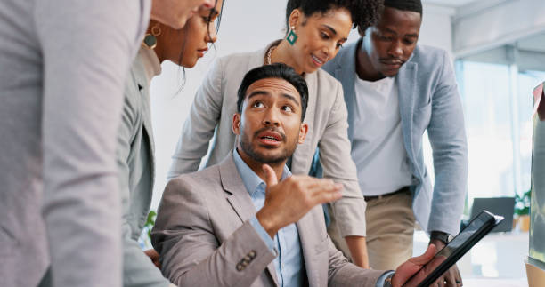 istock Teamwork, collaboration and group of business people with tablet for strategy, planning or brainstorming ideas. Meeting, leadership and employees with technology in discussion for advertising project 1692179132