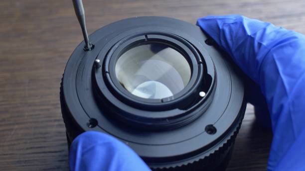 istock Repairing Camera Lens Disassembling Lens and Mechanical Parts Close-up 1692182466
