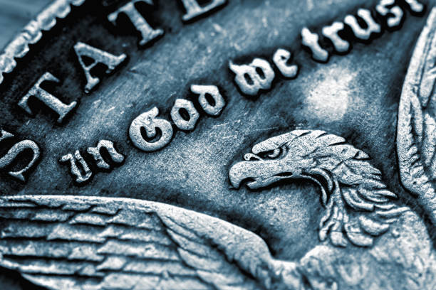 close up coin of us dollar with the inscription: in god we trust. macro image. - in gold we trust imagens e fotografias de stock