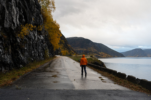 Woman hiking outdoors in Norway. Adventures in autumn Norway, in the Bergen area.