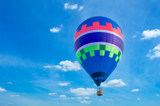 A hot air balloon drifting in the sky.