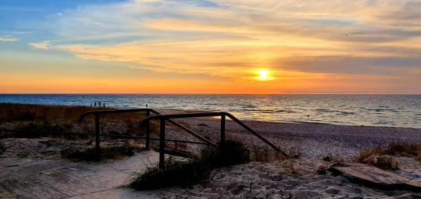 istock Beautiful sunset in a sandy shore 1692195883
