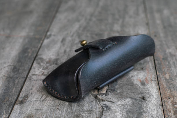 istock Genuine black cow leather glasses case on wood 1692197726