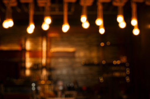 blur hanging light in the dark night bar or pub
