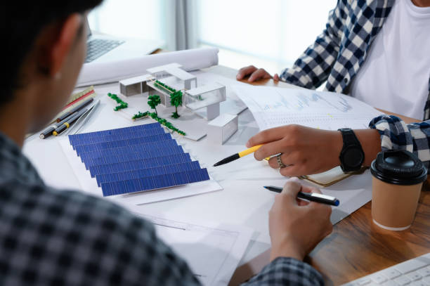 istock Asian Architect Students Studying Modern House Design and Finding Ways to Utilize Natural Alternative Energy or Use Natural Renewable Energy, Concepts of Eco-Friendly Living for a Sustainable Future. 1692203206