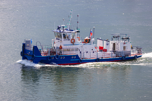 Krasnoyarsk, Russia - 30 June, 2023: View on Angara 93 towing vessel in the middle of the Yenisei River. Type of tugboat, pusher, pusher tug