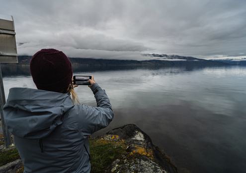 Woman hiking outdoors in Norway. Adventures in winter Norway, in Sognefjord