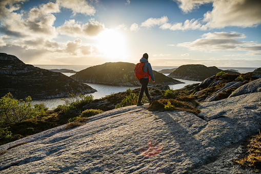 Woman hiking outdoors in Norway. Adventures in winter Norway, in the Bergen area.