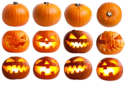 Halloween Jack-o-Lantern Pumpkins on rustic wooden background