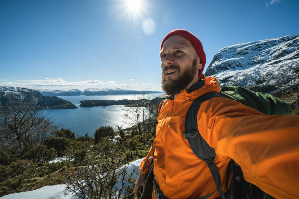 istock Bearded man portrait: selfie in winter Norwegian landscape 1692222027