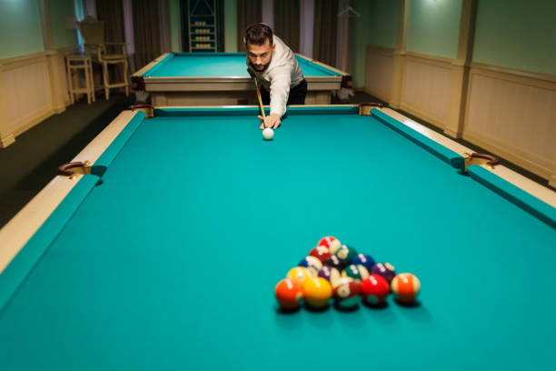 istock Billiard player at billard table or snooker american billiards pool sport game 1692223827
