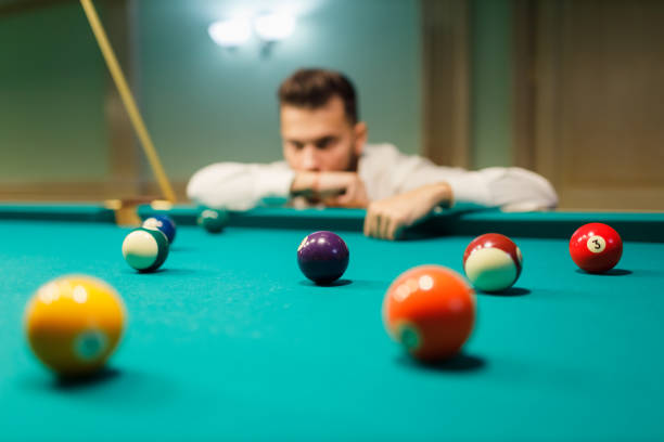 istock Billiard player at billard table or snooker american billiards pool sport game 1692223832