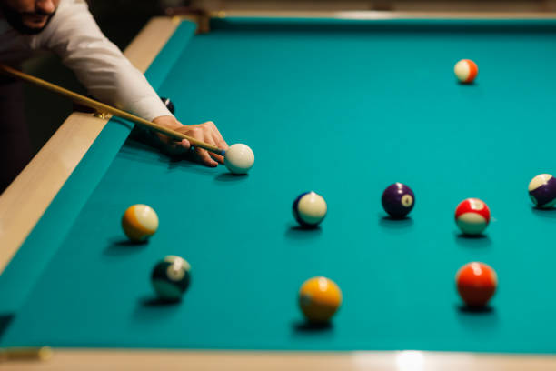 istock Billiard player at billard table or snooker american billiards pool sport game 1692223845