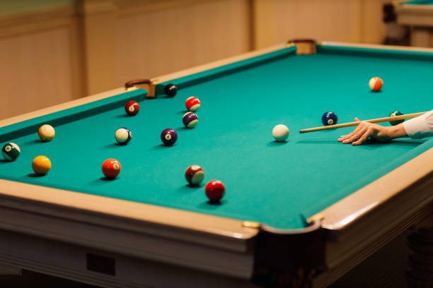 istock Billiard player at billard table or snooker american billiards pool sport game 1692223850