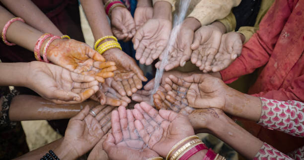 istock Poor Indian children asking for fresh water, India 1692246782