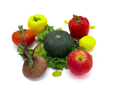 Mixed fruits and vegetables, bell peppers, lemons, pumpkins, beetroot, apples, grapes, salads combined on separate white backgrounds