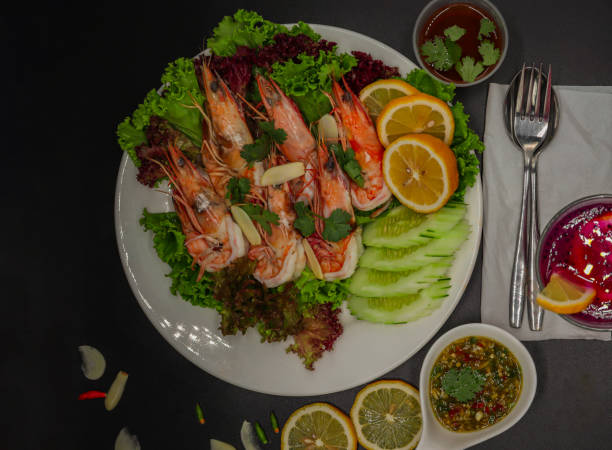 istock Boiled fresh shrimp on a lemon salad plate and cheese sauce 1692267197